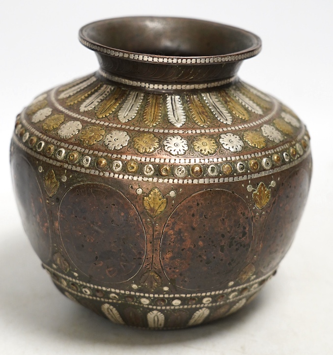 An Indian ganga jumna mixed metal water pot with engraved decoration, 14cm high. Condition - some dents